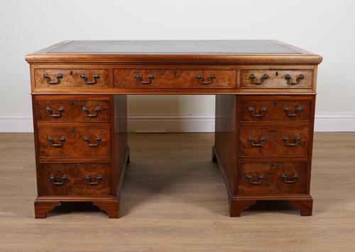 AN EARLY 20TH CENTURY WALNUT NINE DRAWER PEDESTAL PARTNER'S DESK