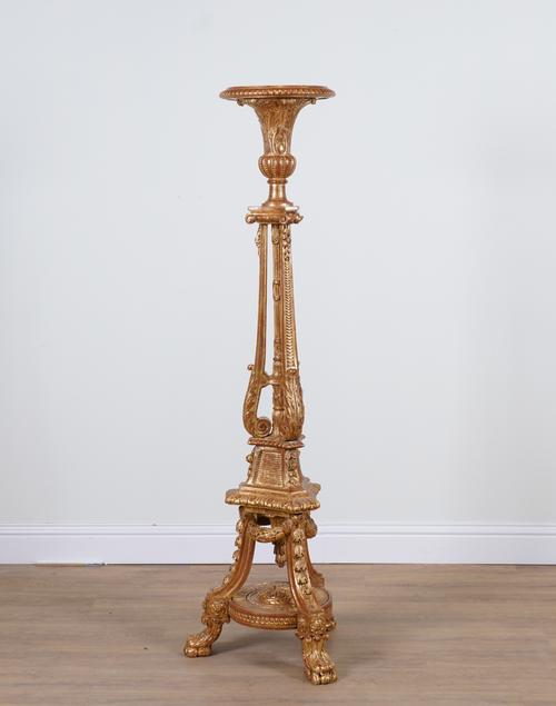 A GEORGE II STYLE GILT TORCHERE STAND
