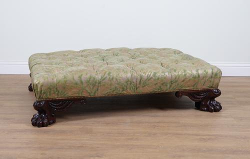 A LARGE GREEN FLORAL BUTTON UPHOLSTERED RECTANGULAR STOOL