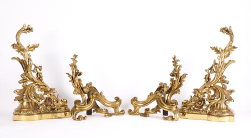 A PAIR OF FRENCH LOUIS XV STYLE GILT-METAL ‘ROCOCO’ CHENETS (4)