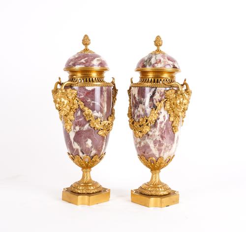 A PAIR OF LOUIS XVI STYLE ORMOLU MOUNTED BRECHE VIOLET LIDDED ORNAMENTAL URNS (2)