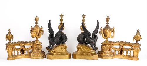 A PAIR OF FRENCH REGENCE STYLE PATINATED AND GILT-METAL DRAGON CHENETS (4)