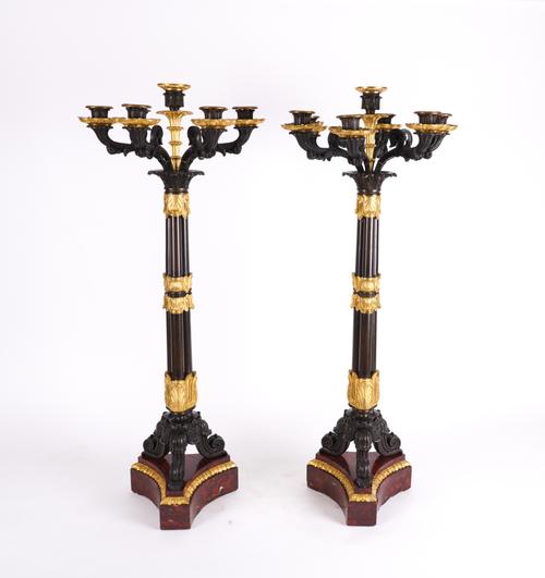 A PAIR OF RESTAURATION STYLE GILT AND PATINATED BRONZE SEVEN -LIGHT CANDELABRA (2)
