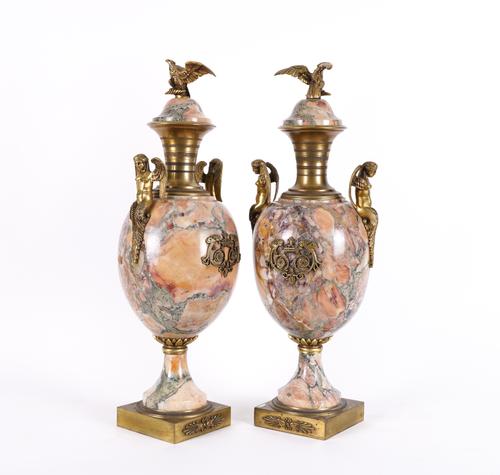 A PAIR OF EMPIRE REVIVAL GILT-METAL MOUNTED BRECCIA MARBLE ORNAMENTAL URNS (2)