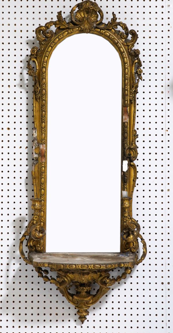 A VICTORIAN GILT FRAMED GIRANDOLE ARCHED TOP MIRROR