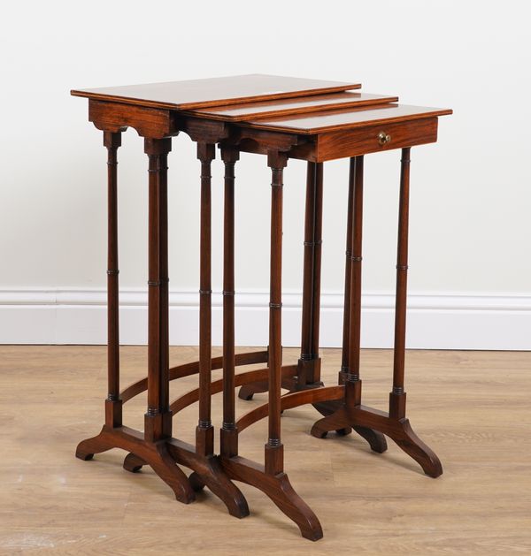 A 19TH CENTURY WALNUT NEST OF THREE TABLES (3)