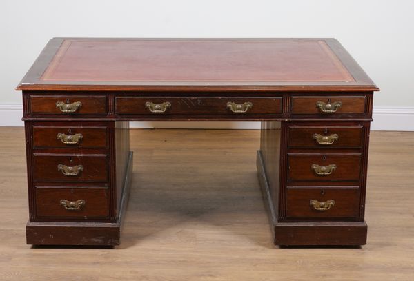 AN EDWARDIAN MAHOGANY NINE DRAWER PEDESTAL PARTNER'S DESK