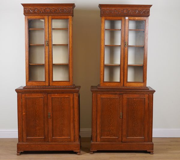 A PAIR OF OAK BOOKCASE CABINETS (2)