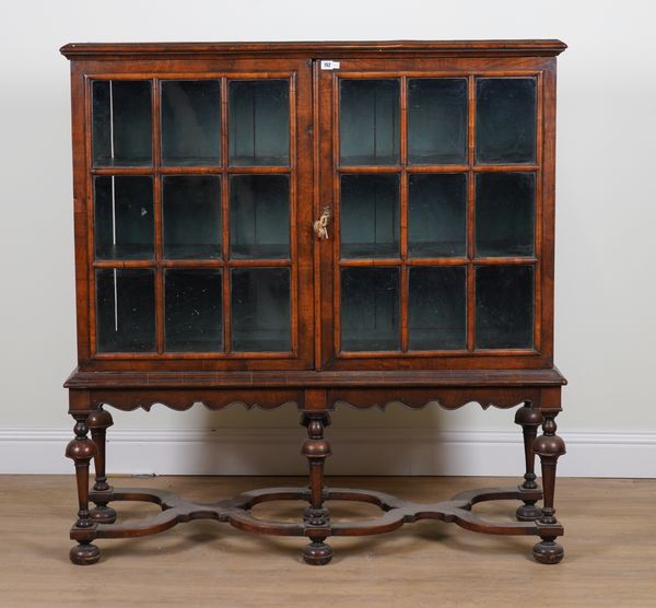 AN 18TH CENTURY STYLE WALNUT DISPLAY CABINET ON STAND