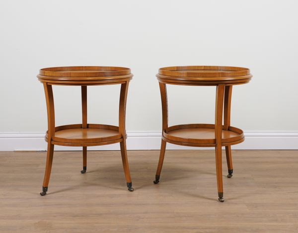 ROBERT KIME MARLBOROUGH ENGLAND; A PAIR OF CIRCULAR OAK TWO TIER OCCASIONAL TABLES (2)