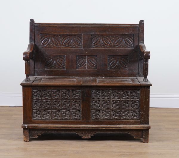 AN 18TH CENTURY OAK SETTLE