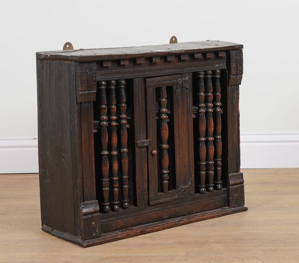 A 17TH CENTURY AND LATER OAK WALL MOUNTED FOOD CUPBOARD