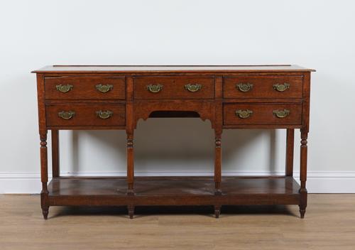 AN 18TH CENTURY OAK FIVE DRAWER POT BOARD DRESSER BASE