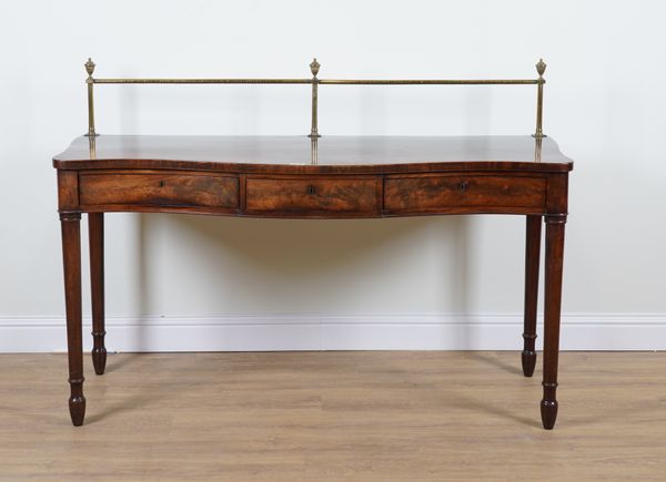 A GEORGE III MAHOGANY SERPENTINE THREE DRAWER SERVING TABLE