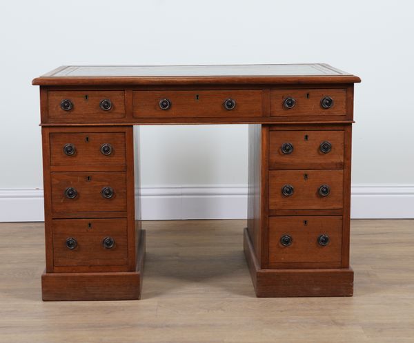 A 19TH CENTURY WALNUT NINE DRAWER PEDESTAL DESK