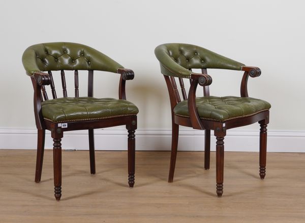 A PAIR OF EDWARDIAN GREEN LEATHER UPHOLSTERED TUB BACK DESK CHAIRS (2)