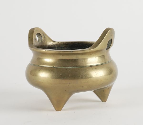 A CHINESE BRONZE TRIPOD CENSER