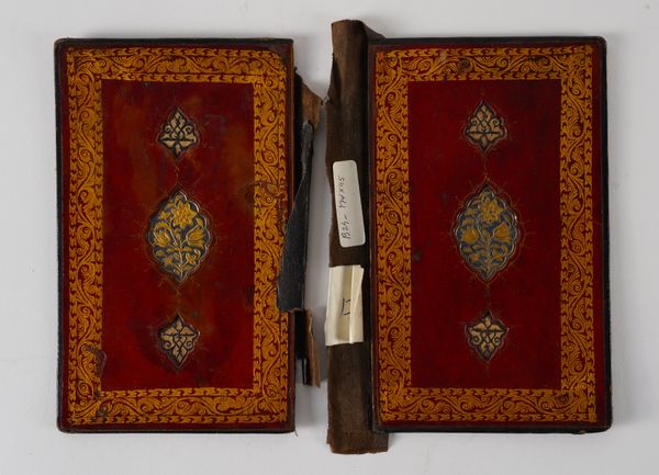 A GROUP OF PERSIAN LEATHER BOOK COVERS (qty)