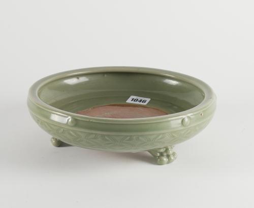 A CHINESE CELADON-GLAZED TRIPOD CENSER