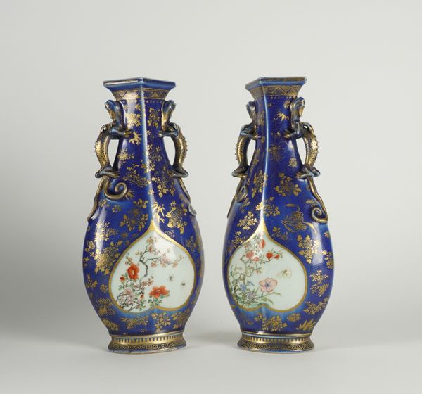 A PAIR OF CHINESE BLUE-GROUND AND GILT FAMILLE ROSE  TWO-HANDLED VASES (4)