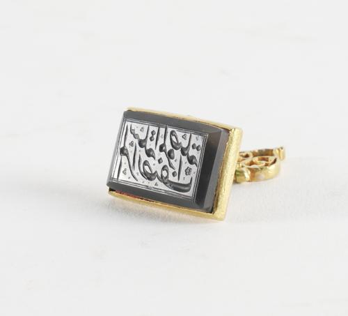 A QAJAR ENAMELLED GOLD AND HARDSTONE SEAL