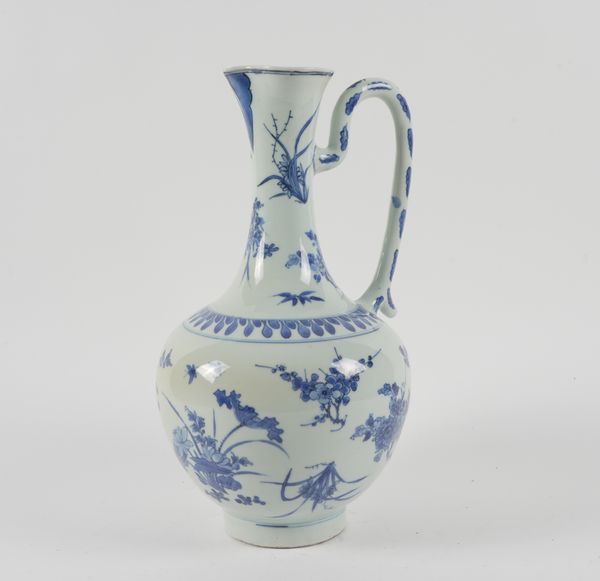 A TALL CHINESE BLUE AND WHITE EWER