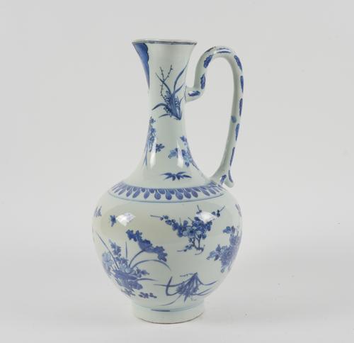 A TALL CHINESE BLUE AND WHITE EWER
