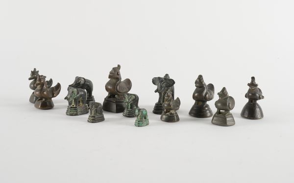 A GROUP OF THIRTEEN BURMESE BRONZE OPIUM WEIGHTS  (13)