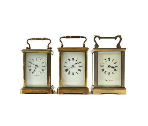 THREE BRASS CARRIAGE CLOCKS WITH CASES (6)