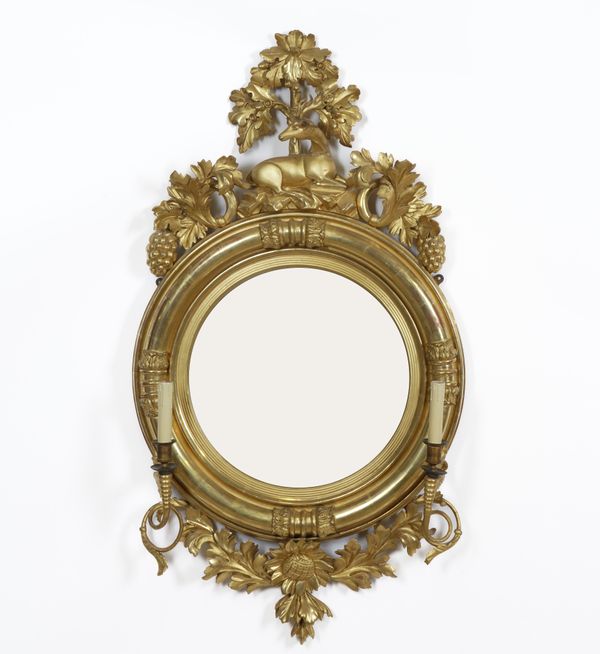 A REGENCY GILT FRAMED CONVEX TWIN BRANCH GIRANDOLE WALL MIRROR