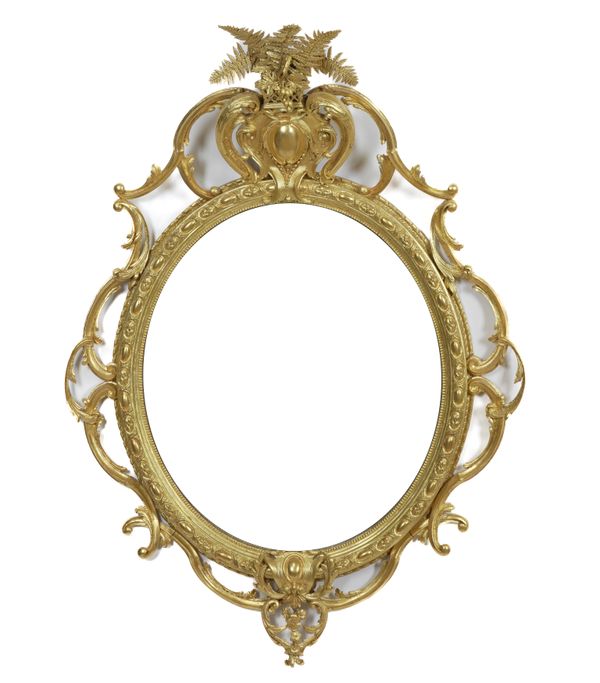 A VICTORIAN GILT FRAMED OVAL WALL MIRROR