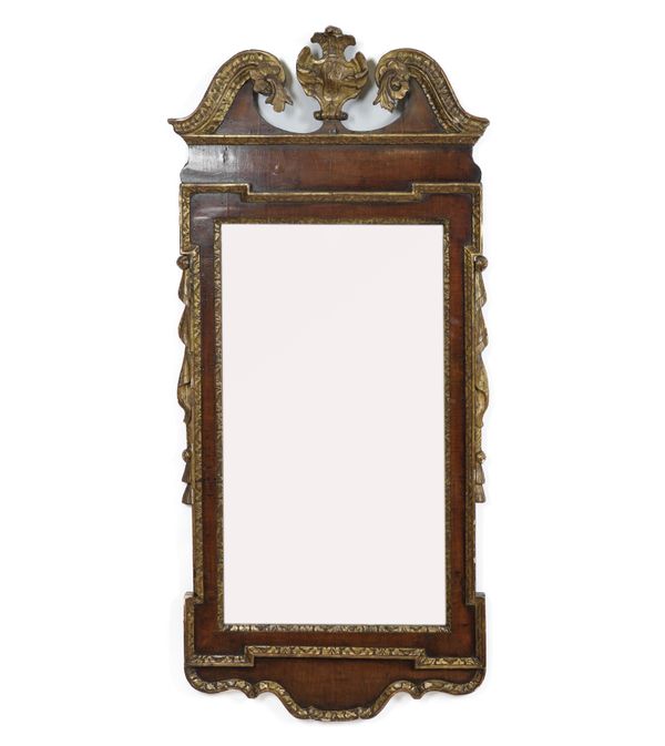 A GEORGE I STYLE WALNUT PARCEL GILT DECORATED PIER MIRROR