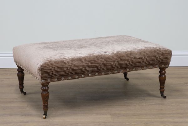 A TAUPE VELVET UPHOLSTERED RECTANGULAR FOOTSTOOL