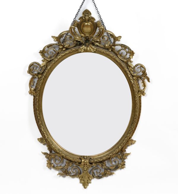 A VICTORIAN GILT FRAMED OVAL WALL MIRROR