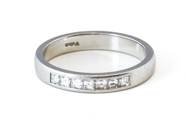 A PLATINUM AND DIAMOND BAND RING