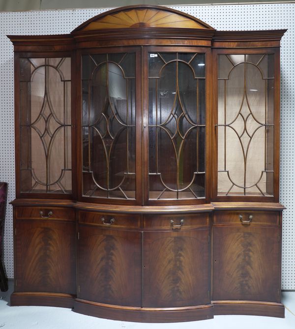 A GEORGE III STYLE INLAID MAHOGANY SERPENTINE FRONTED BOOKCASE CABINET