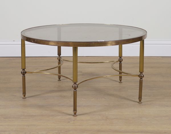 A MID 20TH CENTURY LACQUERED BRASS AND SMOKED GLASS CIRCULAR OCCASIONAL TABLE