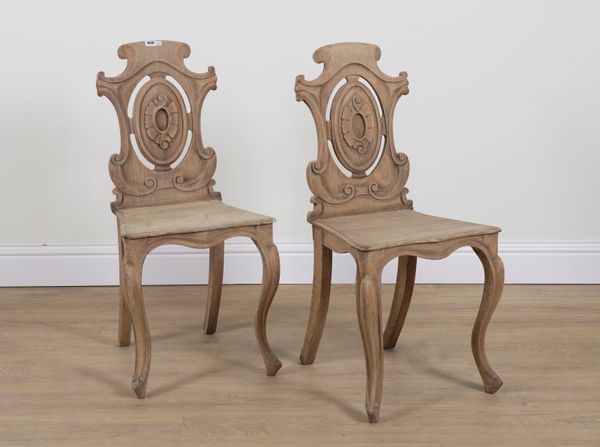 A PAIR OF VICTORIAN BLEACHED OAK LOZENGE BACK HALL CHAIRS (2)