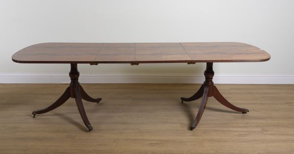 A GEORGE III STYLE WALNUT BANDED MAHOGANY D-END DINING TABLE