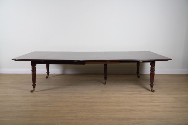 A GEORGE IV MAHOGANY EXTENDING DINING TABLE