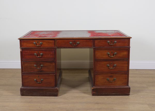 A GEORGE III MAHOGANY NINE DRAWER PEDESTAL DESK