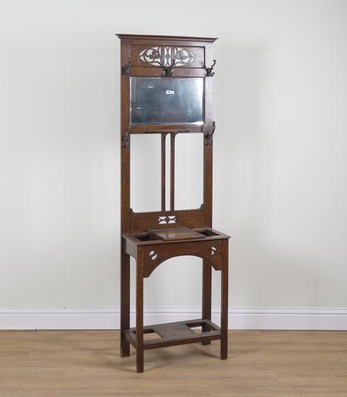 AN ARTS AND CRAFTS OAK MIRROR BACK HALL STAND