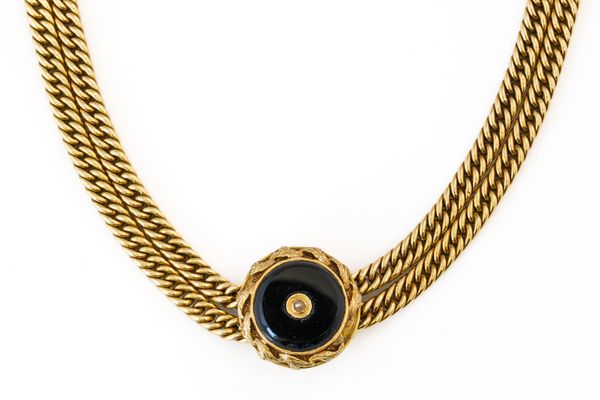 A GOLD TWIN CURB LINK NECKLACE WITH A BLACK ONYX SLIDER