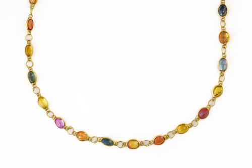 A LONG MULTI COLOURED SAPPHIRE NECKLACE