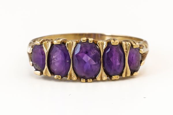 A FIVE STONE AMETHYST RING