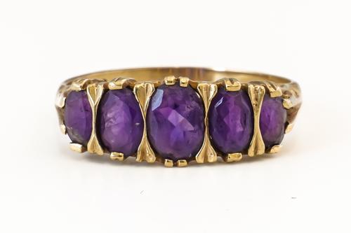 A FIVE STONE AMETHYST RING