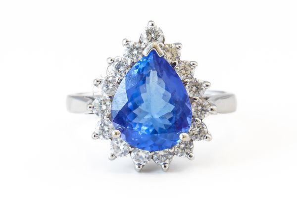 A TANZANITE AND DIAMOND CLUSTER RING