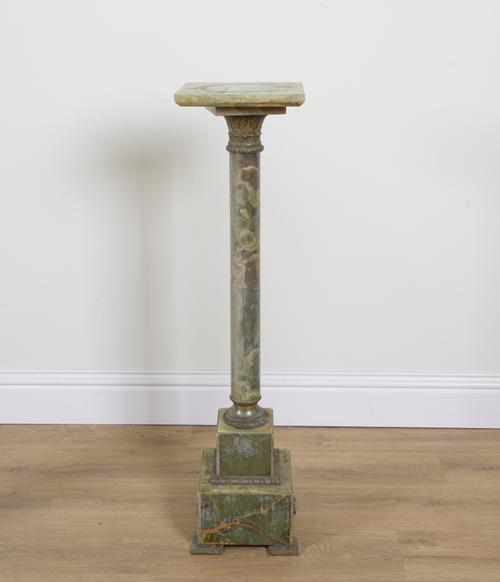 A GILT-METAL MOUNTED ONYX SCULPTURE PEDESTAL COLUMN