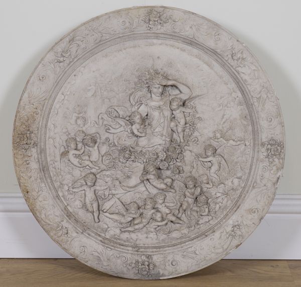 A RELIEF CAST COMPOSITE PLASTER MEDALLION OF ANGEL AND CHERUBS