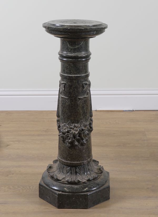 A GREEN SERPENTINE MARBLE PEDESTAL COLUMN